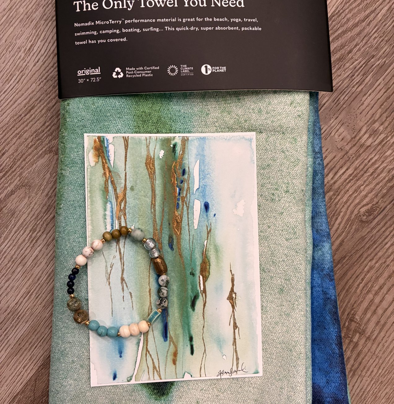 Folded Illumination towel with the print and bracelet