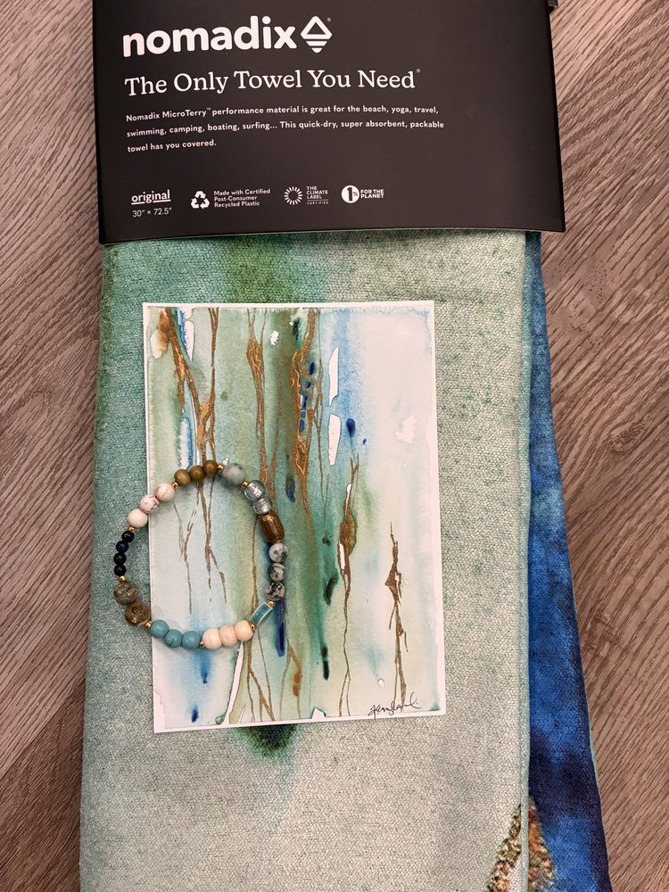 Folded Illumination towel with the print and bracelet